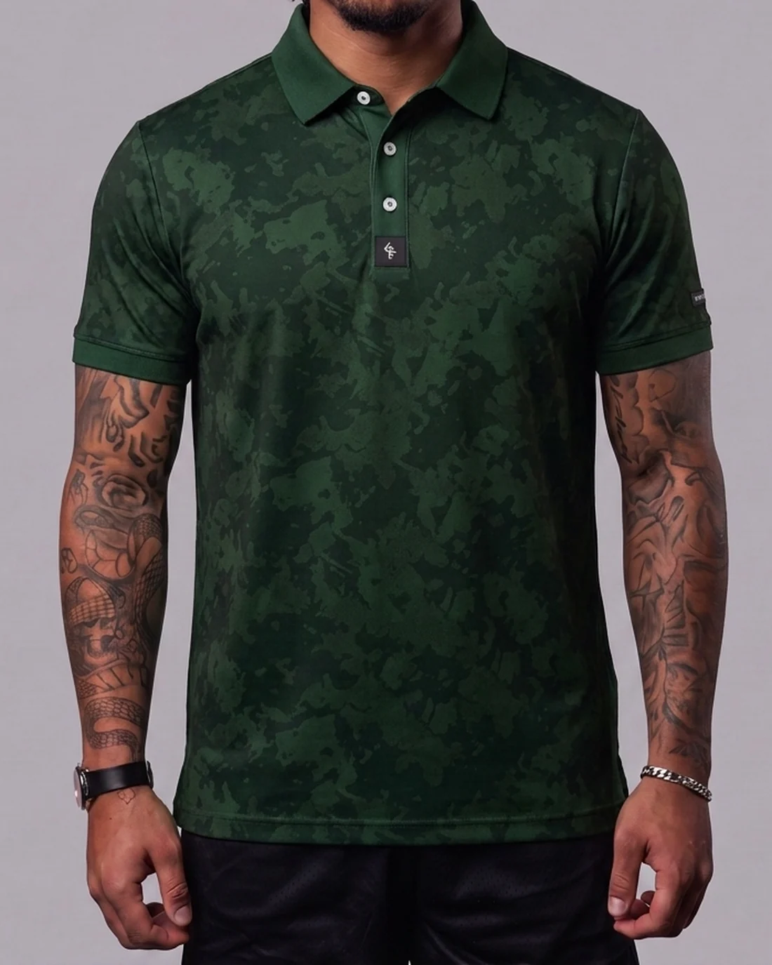 Model wearing the Byrd Gang Obsidian - Forest men’s polo